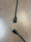 Detail of the connection ends on the Jameson shop light, showing the power input and output ports for stringing multiple units.