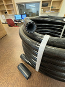 Side view of a new 50-foot roll of 1/2 inch ID black silicone water hose, showing its coiled form.