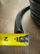 Close-up of new 1/2 inch black silicone hose, with a measuring tape indicating its ID.