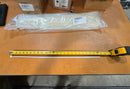 New 25-inch white zip tie measured against a tape measure, confirming its length.