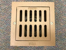 New cast iron floor drain, top view with its 9-inch square grate/cover securely attached.