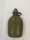 Back view of the like new US military canteen, shown without its canvas cover, highlighting its construction, markings and features.