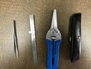 Close-up view of the Clauss Tweezers and Tullen Snips (scissors) from the fiber optic tool kit.