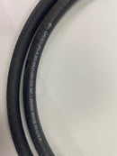 Close-up view of the white factory text printed on the side of the Gates 3/8 inch hydraulic hose, showing specifications like "250 PSI WP 1 Braid" and "Made in USA."