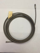 Main top view of the Military Spec Wire Rope Assembly, showing the full length and its identification label clearly.